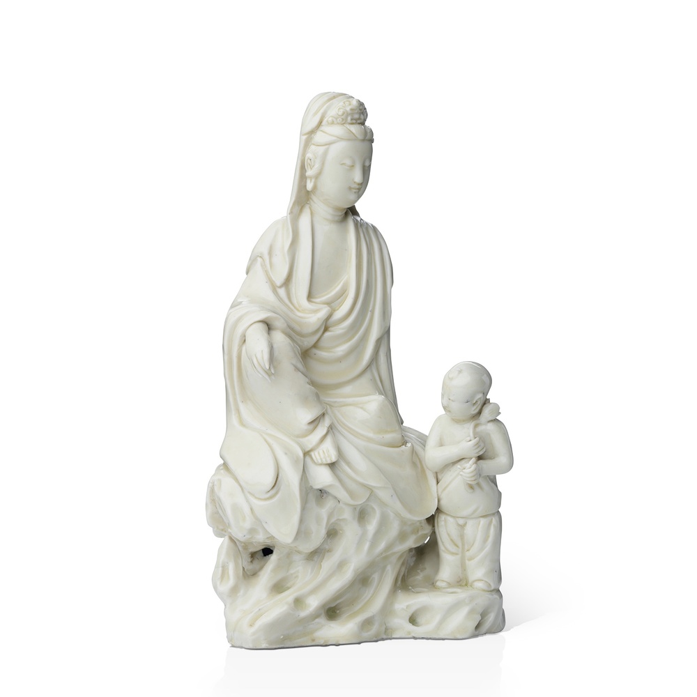 A Dehua figure of Guanyin and boy