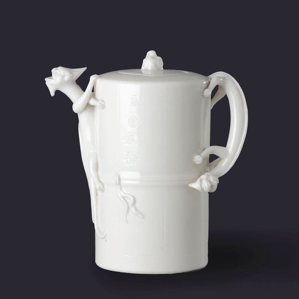 An inscribed dehua winepot and cover