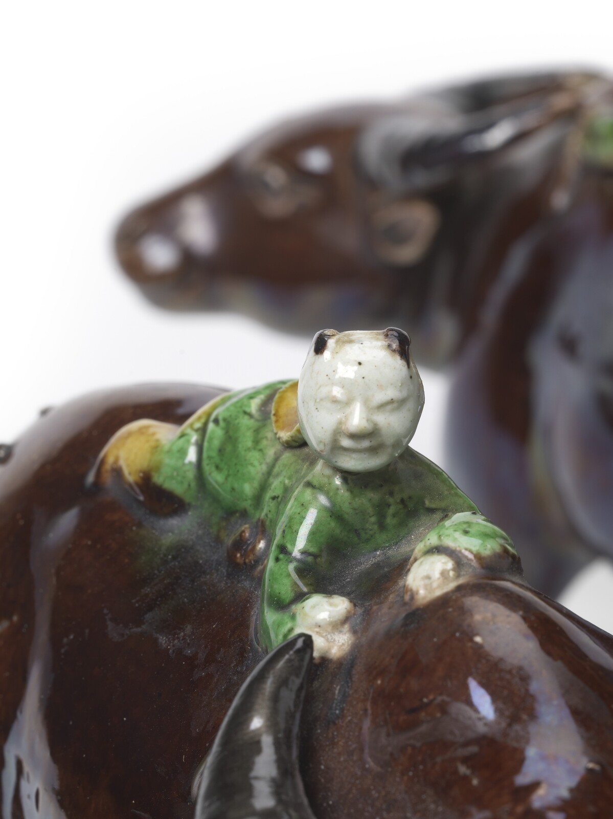 PF 30 A Pair Of Famille-Verte Biscuit Figures Of A Boy On A Buffalo<br><br>清康熙 素三彩牧童臥牛 一對