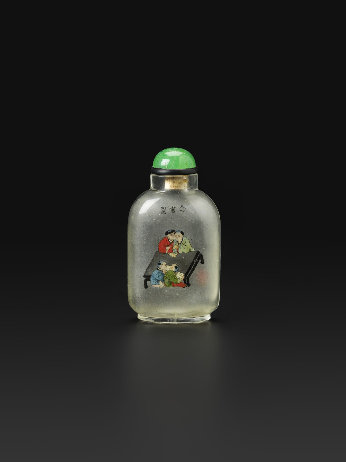 S 45 An Inside-painted Glass Snuff Bottle<br><br>1914 年 馬少宣家族 玻璃內畫「念書圖」鼻煙壺