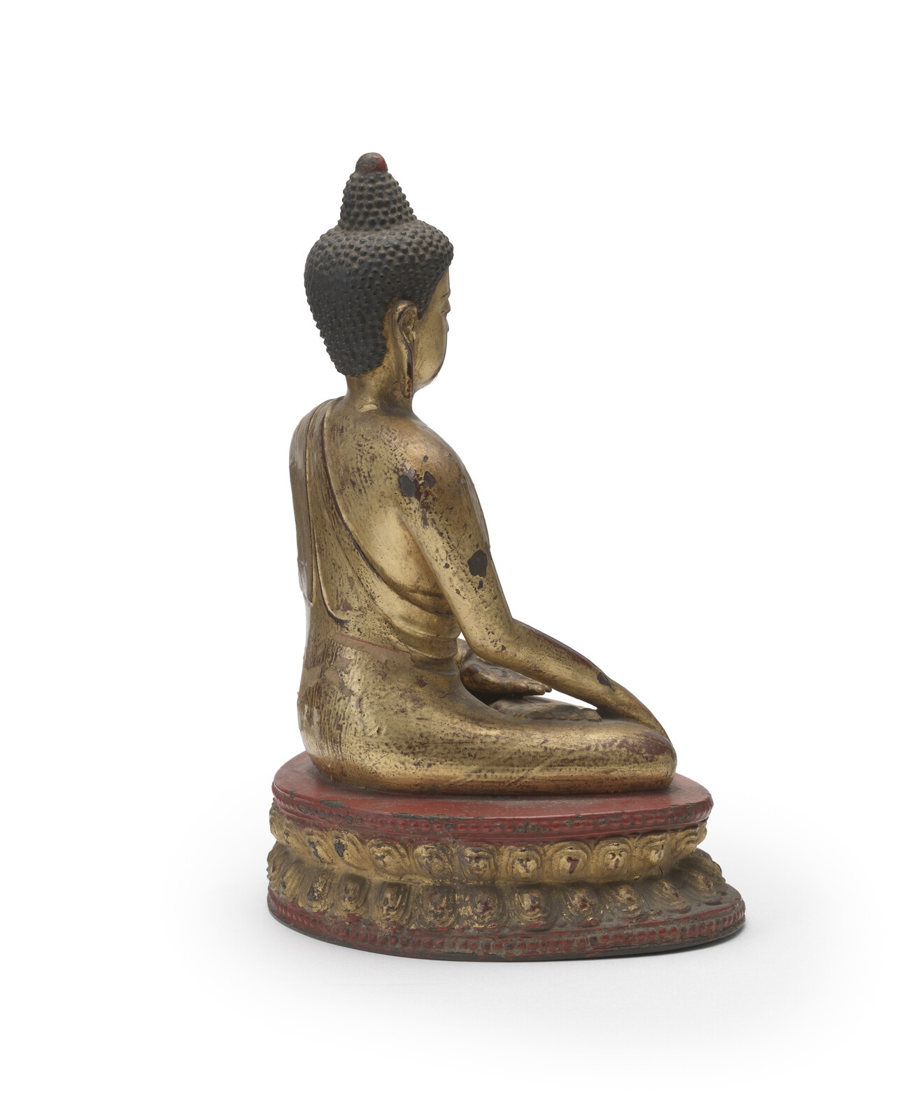 WF 21 A gilt and lacquered bronze figure of Shakyamuni Buddha<br><br>明十六世紀 銅鎏金髹漆釋迦牟尼佛坐像