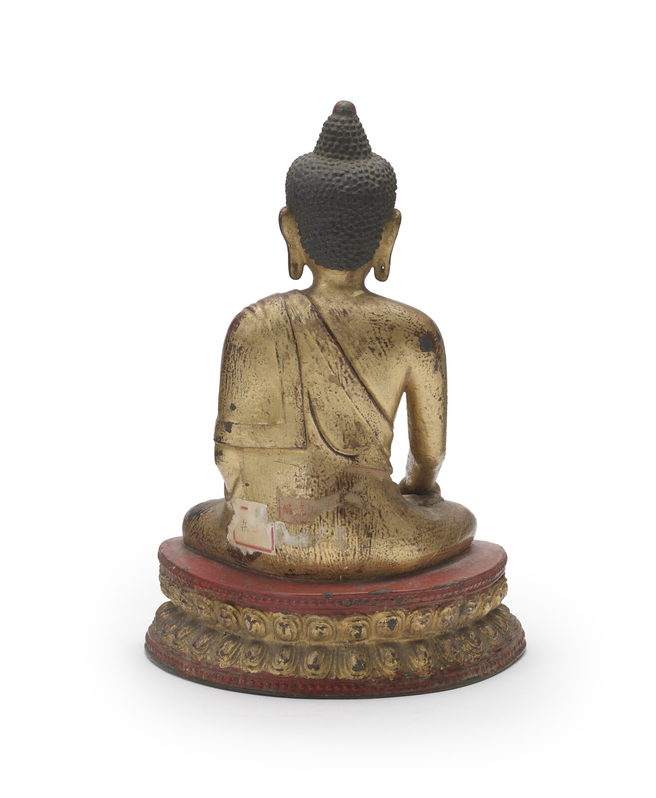 WF 21 A gilt and lacquered bronze figure of Shakyamuni Buddha<br><br>明十六世紀 銅鎏金髹漆釋迦牟尼佛坐像