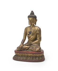 WF 21 A gilt and lacquered bronze figure of Shakyamuni Buddha<br><br>明十六世紀 銅鎏金髹漆釋迦牟尼佛坐像