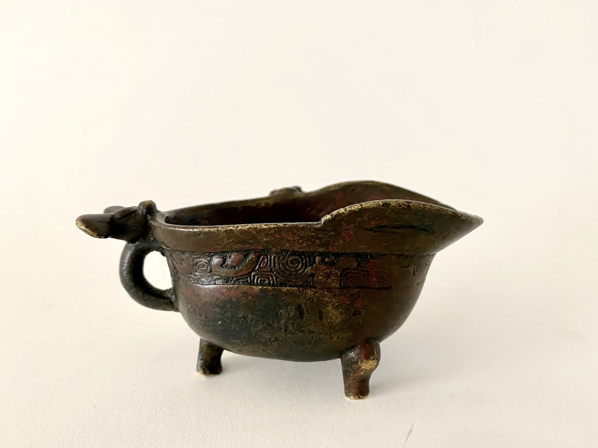 WF 54 A small gilt-bronze drinking vessel<br><br>明銅鎏金飲器